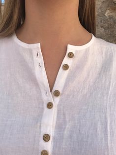 "Gorgeous loose linen shirt with buttons down the front. Simple and feminine silhouette with 3/4 sleeves. An item in your wardrobe that will prove itself as a timeless value. Will suit you perfectly for a day on the beach just as well as a city stroll. An airy and light top to wear. Great comfort provided by the loose, extra long cut and fantastic linen. The rear of the shirt is curved and longer than the back. You can choose different colours from the light and medium light linens. All fantasti Summer Long Sleeve Blouse With Buttons, Bohemian Linen Blouse For Daywear, Summer Blouse With Buttons Relaxed Fit, Summer Blouse With Buttons And Relaxed Fit, Summer White Blouse With Rolled Sleeves, White Blouse With Rolled Sleeves For Summer, Bohemian Blouse With Buttons For The Beach, Bohemian Beach Blouse With Buttons, Vacation Linen Blouse With Button Closure