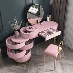 a pink vanity with stool and mirror in a room