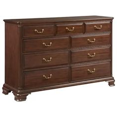 a large wooden dresser with many drawers and pulls on the bottom drawer, it is dark brown