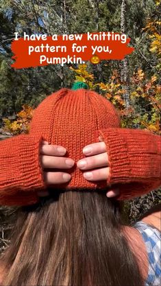 a woman wearing an orange knitted hat with the words i have a new knitting pattern for you, pumpkin