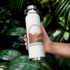 a person holding a white water bottle in front of green plants and leaves with the words chill with nature on it