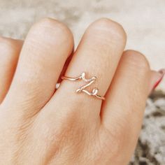 Delicate details make our Initial Ring in Silver a gorgeous addition to your finger! This beautiful piece is slim and trim, with a sweet cursive letter that lets you express yourself and to wear one on top of the other that make your look even more intriguing. This unique ring is made with gorgeous Sterling Silver for a beautiful shine that lasts. Before ordering, please check what else we make * www.etsy.com/shop/bysdmjewels * * Material: High Quality Sterling Silver 925, Gold Filled 12k, Rose Gold Filled 12k * This ring is adjustable (you will receive it in the standard size US7, if you want it adapted to a specific size leave me a note in the personalization box) * Letters like w, e, r, u, i, o, a, s, z, x, c, v, n, m measure approximately 5mm * Letters like q, t, y, p, d, f, g, h, j, k Dainty Adjustable Rose Gold Initial Ring, Z Ring, Ring Initial, Ear Threader, Name Ring, Cursive Letters, Initial Name, Personalized Ring, Ringe Gold