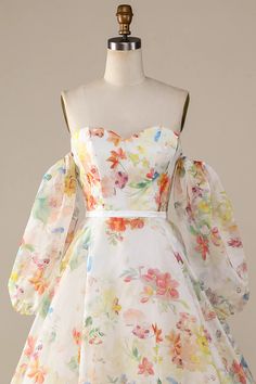 a white dress with colorful flowers on it