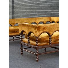 a set of three yellow velvet upholstered chairs