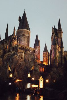 the hogwarts castle is lit up at night