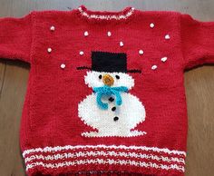 a red sweater with a snowman on it