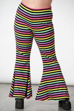 PRISMATIC.- Ribbed, thick, super stretch cotton fabric.- Statement stripe design.- Flared bottoms.- Elasticated waistband.- Fitted.Model is 5ft 7 and wears an 3XL.with KILLSTAR branding, 92% Cotton 8% Elastane. Plus Size Pastel Goth, Perky Goth, Impulse Buying, Outfits To Draw, Rainbow Stuff, Flared Bottoms, Dark Rainbow, Pastel Goth Outfits, Top Clothing Brands