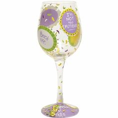 a wine glass with confetti and sprinkles on the bottom is shown