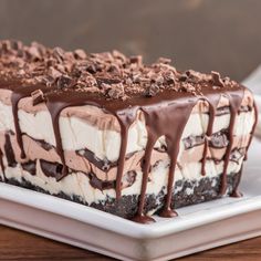 a chocolate and cream dessert on a white plate