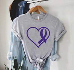 "Lupus Heart Shirt,Lupus Awareness Tee,Gift For Lupus Survivor,Purple Ribbon Heart TShirt,Lupus Fighter Tee,Support Lupus,Lupus Warrior Shirt ----- How To Order ----- 1-) Please, check and review all the photos. 2-) Choose your t-shirt size and color. *Different styles of shirts may have different shades of same color choice due to different manufacturer brands. *For this reason, we recommend you to match shirts from the same styles if you want precisely matching colors (ex. Unisex, V-necks, Tod Purple Casual Top For Awareness Events, Casual Purple Top For Awareness Events, Purple T-shirt For Awareness Events With Letter Print, Purple T-shirt With Letter Print For Awareness Events, Alopecia Awareness, Ribbon Heart, Heart Tshirt, Warriors Shirt, Ribbon Shirt