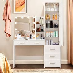 a white vanity with lots of beauty products on it