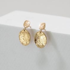 Add a touch of nature to your style with our Birch Drip Studs! Both stud pieces are made from real birch bark and cast into solid 14k yellow gold. The gentle movement and versatility make them perfect for everyday wear, whether dressed up or down. A timeless staple that can be enjoyed by multiple generations. 14k Gold-filled Earrings With Plating, Candle Silhouette, Nature-inspired Gold Flower Earrings With Pressed Flowers, Hypoallergenic 14k Gold-filled Gold Earrings, Birch Bark Earrings, Baroque Pearl Charm Earrings In Yellow Gold, Gentle Movement, Silhouette Ornaments, Birch Bark