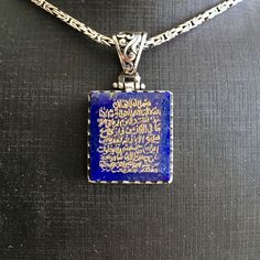 PENDANT: Lapis Lazuli(natural) METAL : .925 Sterling Silver DIMENSIONS : 24 x 22 mm CHAIN: Byzantine King chain METAL : .925 Sterling Silver LENGHT: 55 cm - 21inches THICKNESS: 2 mm What is engraved on the stone? There are certain verses in the Quran that were revealed by Allah to help guide us. They are so powerful that by simply reciting them you, your home and your family would be protected from many evils and from the powers of Shaitan.This verse is ayah 255 from Surah Baqarah commonly refer Artisan Engraved Necklace For Collectibles, Spiritual Engraved Necklaces With Rectangular Pendant, Blue Sterling Silver Necklaces Engraved, Etched Amulet Style Jewelry For Gifts, Blue Engraved Pendant Necklace, Spiritual Etched Jewelry As A Gift, Spiritual Carved Sterling Silver Jewelry, Spiritual Sterling Silver Necklace With Engraving, Spiritual Sterling Silver Etched Necklaces