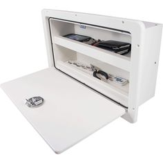 an open white wall mounted cabinet with electronics inside