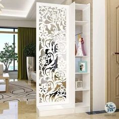 the interior of a living room is decorated in white and features an intricate laser cut design