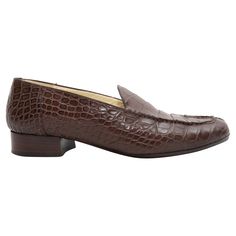 Brown croc skin loafers by Luciano Barbera. Stacked heels. 1" heel height. Classic Moccasins With Crocodile Pattern And Round Toe, Classic Crocodile Pattern Slip-on Loafers, Classic Leather Loafers With Crocodile Pattern, Leather Almond Toe Loafers With Crocodile Pattern, Formal Brown Crocodile Pattern Moccasins, Business Crocodile Pattern Almond Toe Loafers, Classic Crocodile Pattern Oxfords For Office, Classic Office Dress Shoes With Crocodile Pattern, Classic Crocodile Pattern Loafers For Business