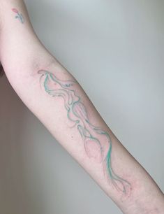 a person with a tattoo on their arm