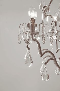 a chandelier with crystal drops hanging from it