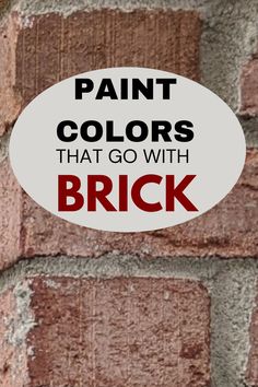 a brick wall with the words paint colors that go with brick in red and white