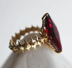 Best seller at Capucinne - This is a one of a kind show stopper. A unique statement snake skeleton ring with 5ct red garnet. Truly unique and eye catching ring. Details Gemstone: natural red garnet Weight: 5ct Available in 14k/ 18k yellow, Vampire Ring, Snake Skeleton, Skeleton Ring, Magical Jewelry, Jewelry Accessories Ideas, Snake Ring, Garnet Ring, Jewelry Lookbook, Pretty Rings