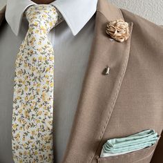 Handmade with 100% imported cotton fabric. Perfect for work, weddings or a night out on the town. This Floral Marigold Yellow Tie will make you feel like the gentleman you aspire to be or accentuate the gentleman you already are. You’ll look good, feel good and do good things in this tie. Makes the perfect gift for a fellow gentleman or for that man in your life by making them look good and feel good. We guarantee your satisfaction with our free refund policy.* Goes Good With: Brown, Beige, Tan, Floral Tie Groomsmen, Floral Tie Wedding, Mens Floral Tie, Prom Inspo, Flower Tie, Marigold Yellow, Work Fits, Yule Ball, Beige Suits