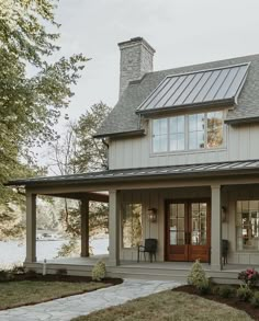 a small house with a porch and covered patio