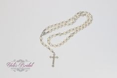 "FAST SHIPPING Beautiful and Unique Silver Handcrafted Rosary  19.5\" silver linked chain with round faux pearl beads and textured silver crucifix. Great for Wedding, Christening, First Communion, Confirmation, Gift, etc. FAST SHIPPING: We usually ship in 1 or 2 business days. A lot of our items are one of a kind and sells really fast. So if you really like something, don't wait to order." Adjustable Silver Pearl Bridal Necklace, Adjustable Silver Pearl Necklace For Wedding, Silver Bridal Necklace With Round Beads For Wedding, Silver Pearl Bridal Necklace For Marriage, Silver Pearl Bridal Necklace With Round Beads, Silver Beaded Chain Bridal Necklace For Wedding, Silver Beaded Bridal Necklace For Wedding, Silver Pearl Necklace With Silver Beads For Wedding, Silver Pearl Necklace With Round Beads For Wedding