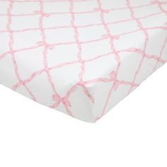 a pink and white bed sheet with lines on the top, in front of a white background