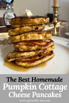 the best homemade pumpkin cottage cheese pancakes are stacked on top of each other with syrup drizzled over them