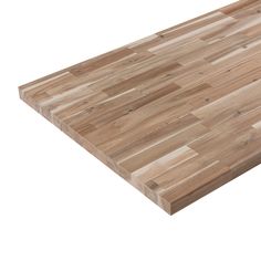 a large wooden cutting board sitting on top of a white surface with no one around it