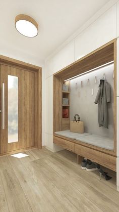 a white room with wooden floors and doors