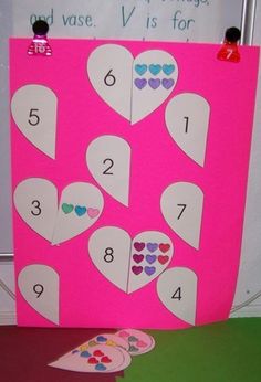 a pink board with hearts cut out on it