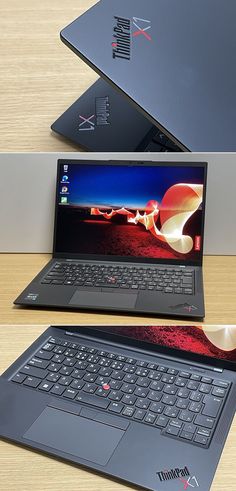 three laptops sitting on top of a wooden table