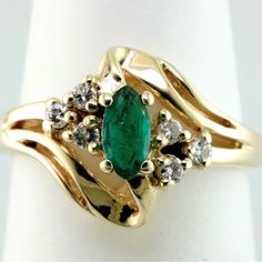 This 14k Yellow Gold Mounting Holds A .20ct Marquise Cut Emerald Along With .10ctw Of Si G/H Accent Diamonds. Size 6 Vintage Green Emerald Ring With Multi-stone, 14k Gold Multi-stone Emerald Ring For May Birthstone, Luxury Exquisite Multi-stone Emerald Ring, Elegant Multi-stone Emerald Ring In 14k Gold, Vintage Multi-stone Emerald Ring In 14k Gold, Princess Diamond Ring, Diamond Fashion Rings, Sapphire Diamond Ring, Princess Diamond