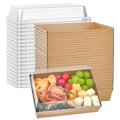 a box filled with assorted fruits and cheeses next to a cardboard box full of other boxes