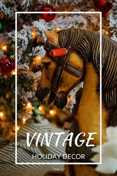 a horse statue sitting in front of a christmas tree with the words vintage holiday decor on it