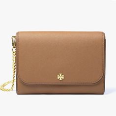 This Tory Burch Emerson Chain Wallet Leather Cross Body Bag Is A Versatile Accessory Suitable For Any Occasion. The Bag Features A Magnetic Snap Closure, A Detachable Strap, And A Convertible Design That Allows It To Be Worn As A Crossbody Or Over-The-Shoulder. It Is Made Of High-Quality Leather With A Jacquard Lining And Metal Hardware, Ensuring Durability And Style. The Bag Has A Medium Size And A Solid Pattern, Making It A Perfect Addition To Any Outfit. It Has Multiple Pockets And Inner Divi Beige Wallet On Chain For Everyday Use, Elegant Brown Wallet On Chain With Detachable Strap, Classic Gold Wallet On Chain For Travel, Classic Brown Wallet On Chain With Chain Strap, Classic Brown Wallet On Chain, Elegant Brown Wallet On Chain With Chain Strap, Formal Brown Crossbody Wallet On Chain, Classic Brown Wallet On Chain With Detachable Strap, Elegant Tan Wallet On Chain With Gold-tone Hardware