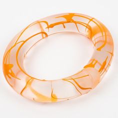 Rare English designer Marlene McKibbin Lucite or Acrylic bracelet bangle. This bracelet is transparent frosted with an open coiled design and has an orange acrylic screening ink application.  Measurements: inside across is 2.75 in wide x 2.50 in deep (7 x 6.4 cm) - width is 0.82 in (2 cm) - inner circumference is 8.25 in (21 cm). It will best fit a Medium-sized wrist of 7.07 in circumference maximum (18 cm).  Reference: Check the last two pictures. This special design was pictured in "Classic Pl Acrylic Rod, Acrylic Bracelet, Lucite Jewelry, English Design, Acrylic Jewellery, Bracelet Bangle, Special Design, Bangle Bracelets, Bangles