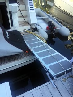 the boat is docked at the dock and ready to be loaded into the water by its owner