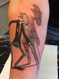 a man with a hat on his head and a cartoon character on his arm