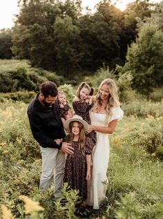 a family standing in the middle of a field