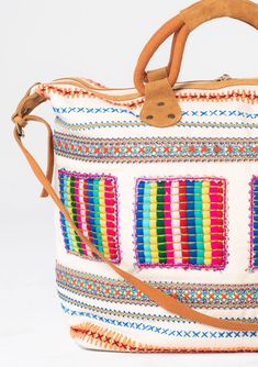 Travel in style with this ultra-bohemian weekender travel bag. A colorful statement piece featuring embroidered details, a zip-top closure, and suede trim. The large carry-all size is perfect for last-minute getaways. Embroidered Stitch details Zip-top closure Suede leather top handles Leather shoulder strap Bohemian weekender bag Dimensions: 24" X 17 3/4"Style: DR-8474 Multicolor Embroidered Hobo Bag For Travel, Embroidered Multicolor Hobo Bag For Travel, Multicolor Weekender Bag With Zipper For Daily Use, Multicolor Travel Bag With Zipper For Weekend Trips, Multicolor Large Capacity Weekender Bag For Trips, Travel-ready Multicolor Embroidered Hobo Shoulder Bag, Multicolor Tote Duffle Bag For Weekend Trips, Travel Hobo Bag With Multicolor Embroidery, Multicolor Rectangular Weekender Bag With Zipper