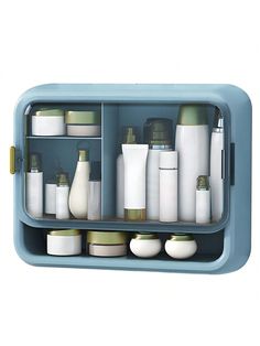 the container is filled with all kinds of items in it's storage compartment, including toothbrushes and shampoos