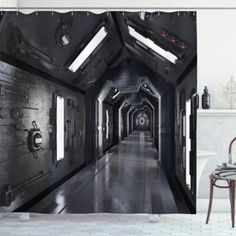 an image of a long hallway with lights on the ceiling and windows in the wall