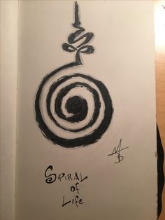 the spiral of life is written in black ink