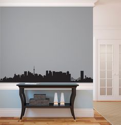 a living room wall with a city skyline decal