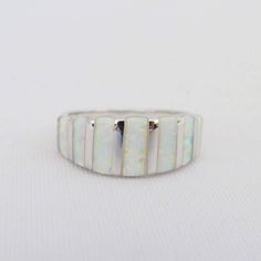 Vintage Sterling Silver Inlay White Opal Band Ring ...Marked 925...Total of weights 4.3grams...Size 5...Measure of Face 8.3MM...It's in very good condition. Luxury Silver Opal Ring With Inlay, Opal Band Ring, Opal Band, White Opal, Sterling Silber, Vintage Sterling Silver, Band Ring, Band Rings, Jewelry Rings