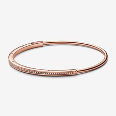 Elevate your outfit with the Pandora Signature I-D Pavé Bangle. Finished in 14k rose gold plating, this much-loved design features an architectural square-and-round profile with a channel of pavé for subtle sparkle. Stack with other Pandora Signature I-D bangles to create your own iconic look. - Pandora Signature I-D Pavé Bangle - 14k Rose gold-plated unique metal blend / Cubic Zirconia / Clear - Sz. 7.5 in Pandora Rose Gold, Pave Bangle, Classic Bangles, Pandora Rose, Bracelet Pandora, The Bangles, Gold Plated Bracelets, Pandora Bracelet, Geometric Earrings