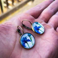 Adorable Comfortable Transitions From Day To Night These Vintage Antique-Style Boho Fashion Earrings Are Cute, Comfortable For Everyday Wear, And Easily Transition From Day To Night. Their Secure Flat Lever-Back Keeps Them From Slipping Out And Won’t Poke Your Neck. They Are Also One-Of-A-Kind And Despite Looking Premium, They Are Inexpensive. Features Vintage Bronze Cabochon Glass (Dia 12 Mm) Flat Lever-Back, Drop Length 1” Handmade Benefits * Lightweight, Comfortable Secure Closure. Sleep Frie Handmade Blue Round Flower Earrings, Blue Birth Flower Earrings, Blue Flower Earrings With Birth Flower Detail, Adjustable Blue Flower Earrings, Blue Round Flower Earrings Hypoallergenic, Blue Flower Earrings With Ear Wire For Summer, Blue Round Hypoallergenic Flower Earrings, Blue Flower Dangle Earrings For Summer, Blue Flower Earrings For Summer