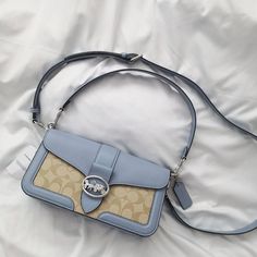 New Coach Georgie Shoulder Bag In Signature Canvas C4067 $398 Silver/Light Khaki/Marble Blue Signature Coated Canvas, Refined Pebble Leather And Smooth Leather| Inside Zip Pocket Snap Closure, Fabric Lining Detachable Handle With 9" Drop Outside Open Pocket Detachable Strap With 22" Drop For Shoulder Or Crossbody Wear 10 3/4" (L) X 5 1/2" (H) X 2 3/4" (W) Luxury Blue Flap Bag For Travel, Designer Blue Flap Bag With Removable Pouch, Blue Coated Canvas Satchel Bag, Elegant Coated Canvas Flap Shoulder Bag, Elegant Coated Canvas Shoulder Flap Bag, Blue Coated Canvas Satchel, Coated Canvas Flap Bags With Branded Hardware, Flap Bags In Coated Canvas With Branded Hardware, Blue Flap Bag With Dust Bag